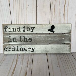 Wooden find joy sign with paper clip
